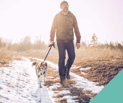 Man walking Dog in snow