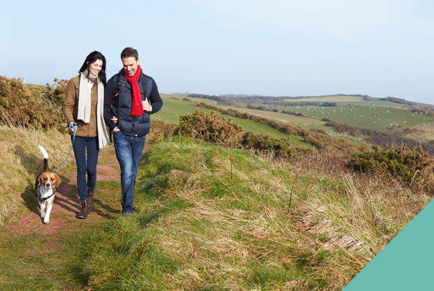 couple walking their dog